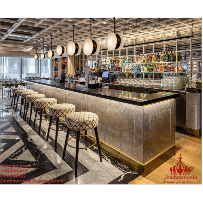 Brass pendant ceiling light illuminating a modern kitchen island, showcasing elegant glass pendant lights for a stylish living space