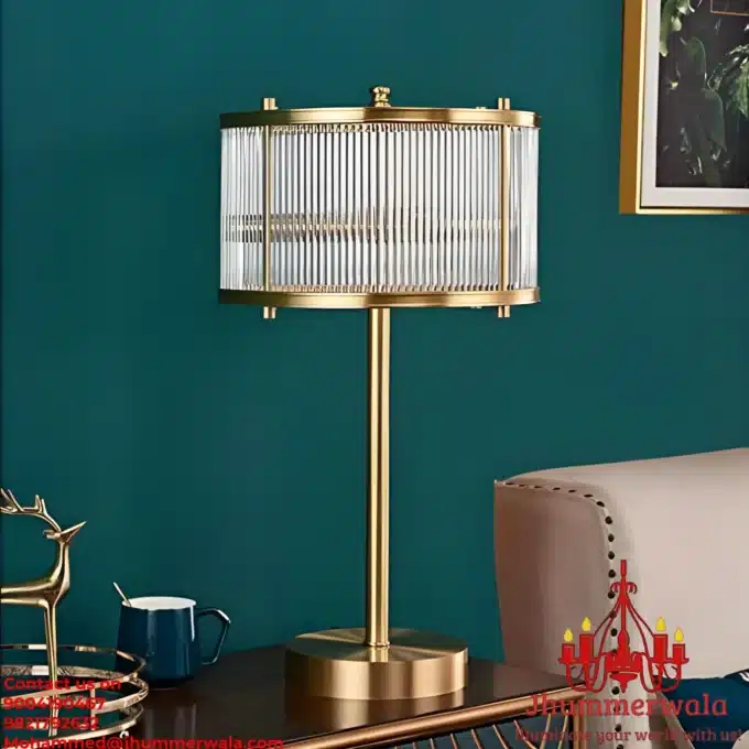 Experience sophistication with the Aurelian Glow table lamp, featuring an intricate design of brass rods converging into a captivating glass rod circle at the end.