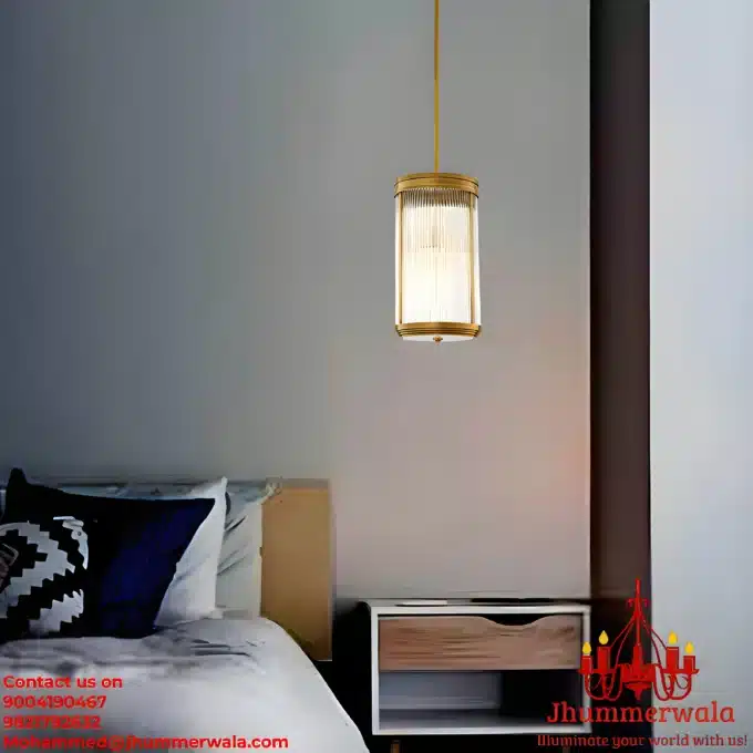 Glass Glow Pendant showcasing its elegant design with brass fitting and glass rods, illuminating a sophisticated interior space.