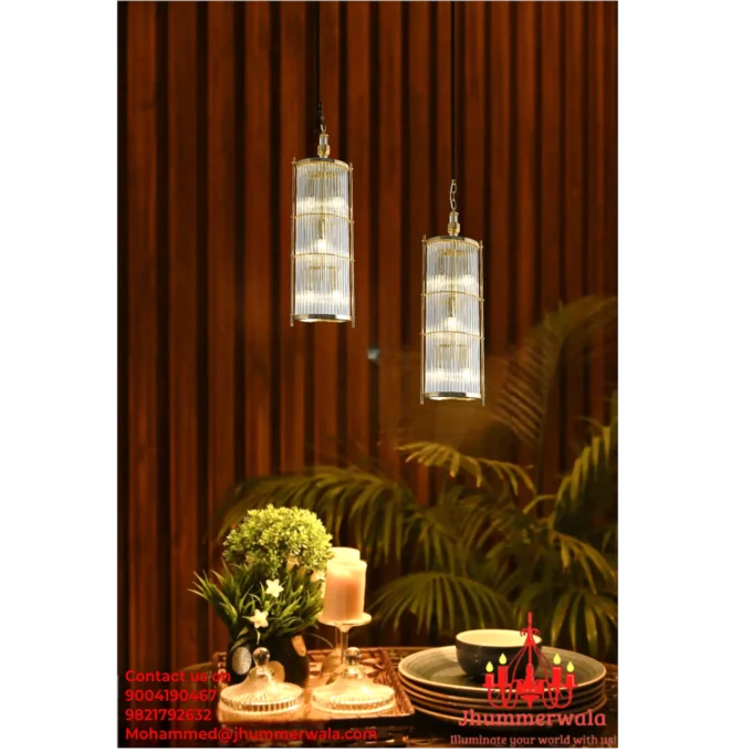 Modern "Golden Lumina Glass Rod Pendant" with brass fitting in matte gold finish, perfect for living room decor.