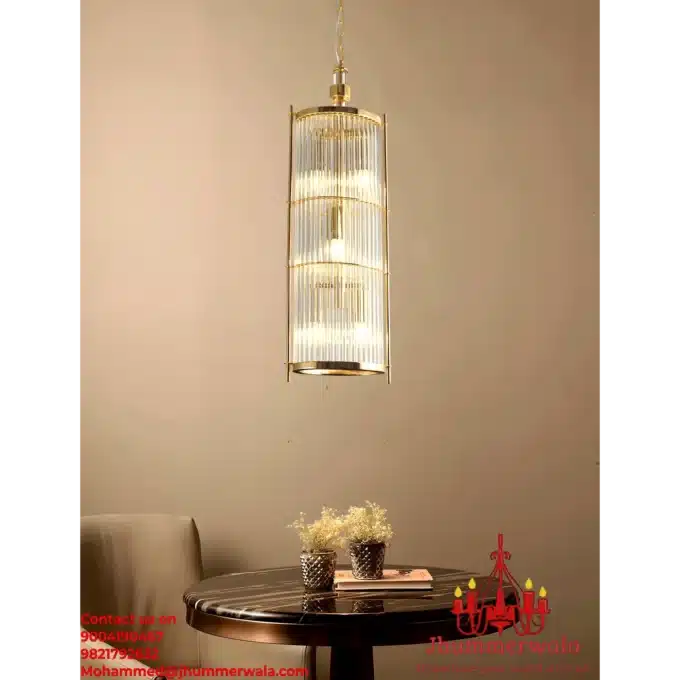 Modern "Golden Lumina Glass Rod Pendant" with brass fitting in matte gold finish, perfect for living room decor.